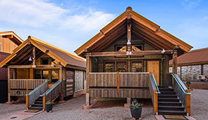 Small 3D image of a bungalow with a wood slat triangular shaped roof at Moab Springs Ranch.