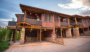 Small image of a brown townhouse unit at Moab Springs Ranch in Utah with a covered balcony and garage.
